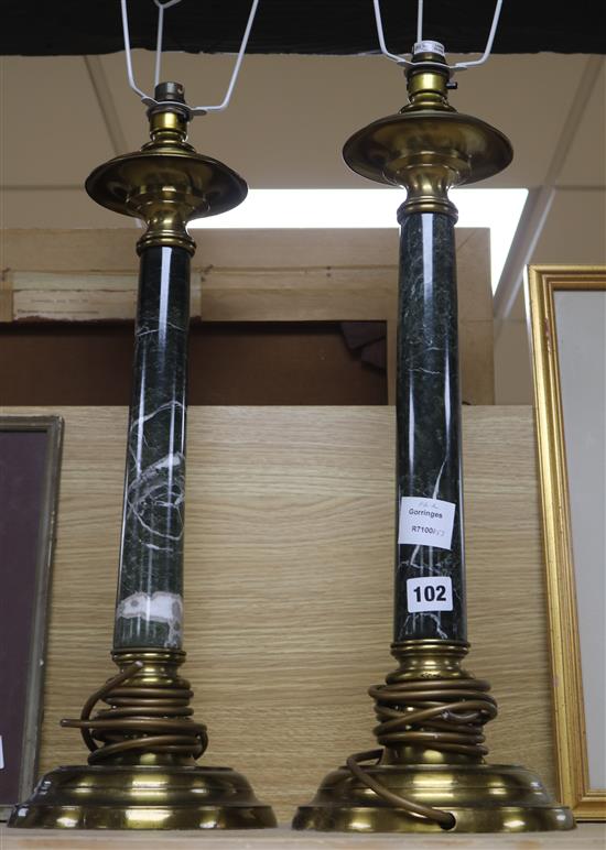 A pair of gilt metal and green marble columnar table lamps, with shades over height 56cm